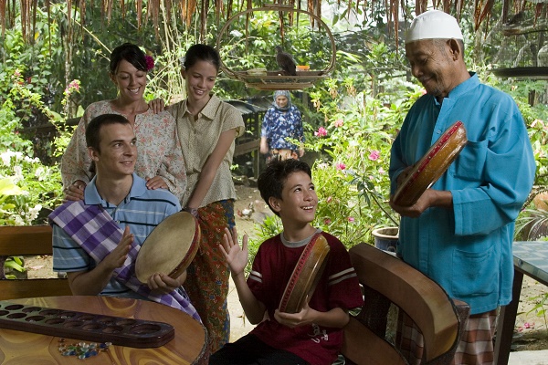 Learning traditional Malay music at a homestay in Langkawi. Image courtesy of Tourism Malaysia.
