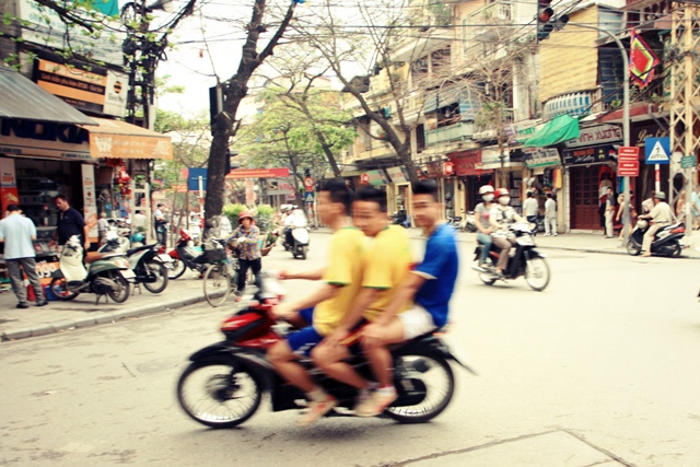 Motorcycle riders in the Old Quarter, Hanoi, Vietnam